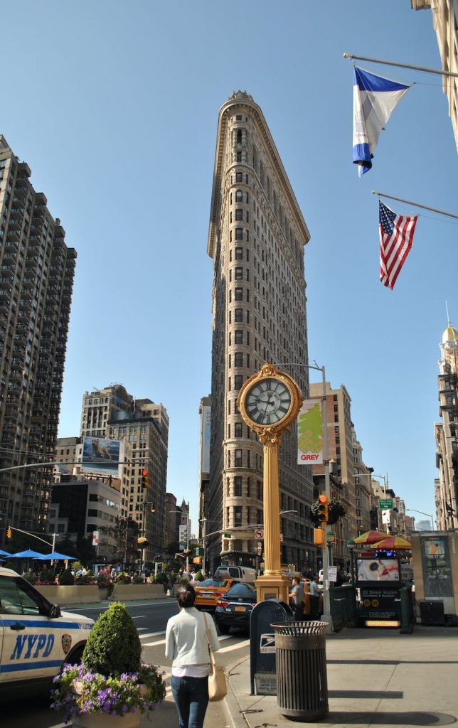 city street with a yellow clock